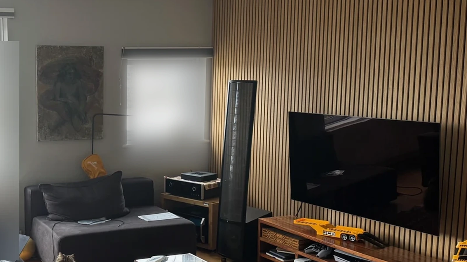 Left-side window and boundary constraint beside a MartinLogan electrostatic loudspeaker.
