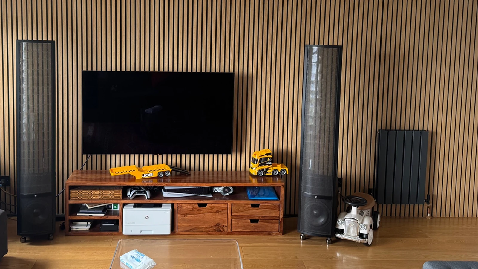 Hardwood floor and glass coffee table in front of the reference stereo system.